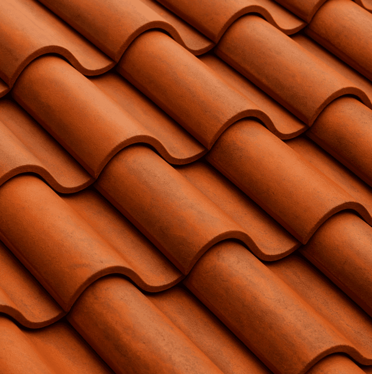 Close-up of Brava composite roof tiles with a terracotta hue and curved S-tile profile, showing realistic texture and color variation under soft daylight.