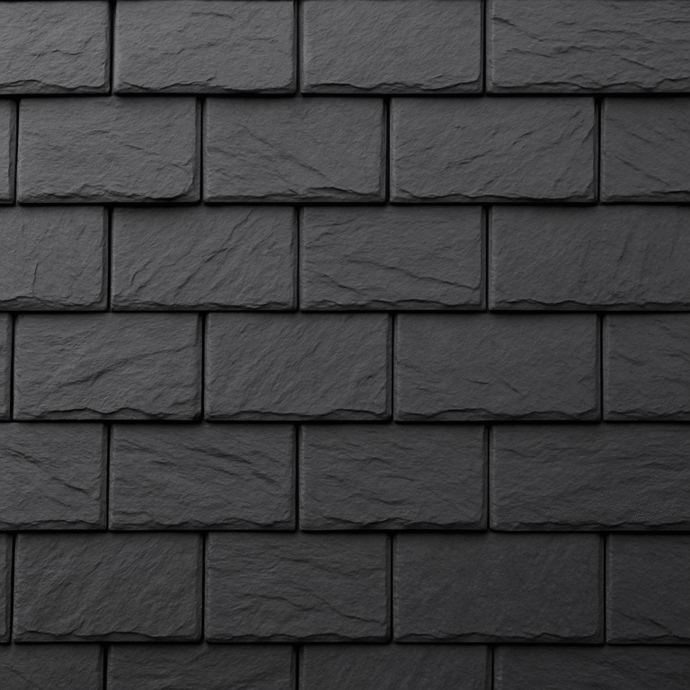 Close-up of dark gray composite roof shingles designed to replicate the texture of natural slate, installed on a residential roof under soft daylight.