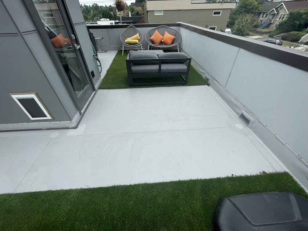 Seamless flow and clean look on a Seattle deck by Orca Roofing.

