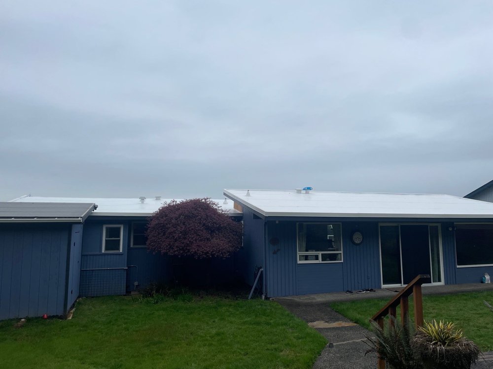 Flat roof replacement in Bellevue by Orca Roofing & Exteriors.

