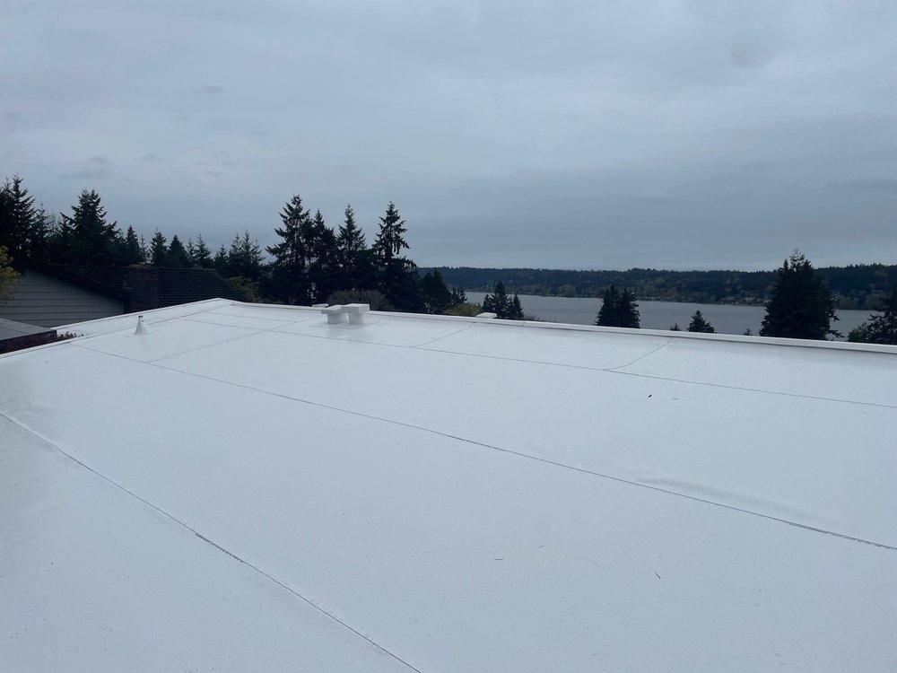 Professional flat roof replacement in Bellevue, WA.