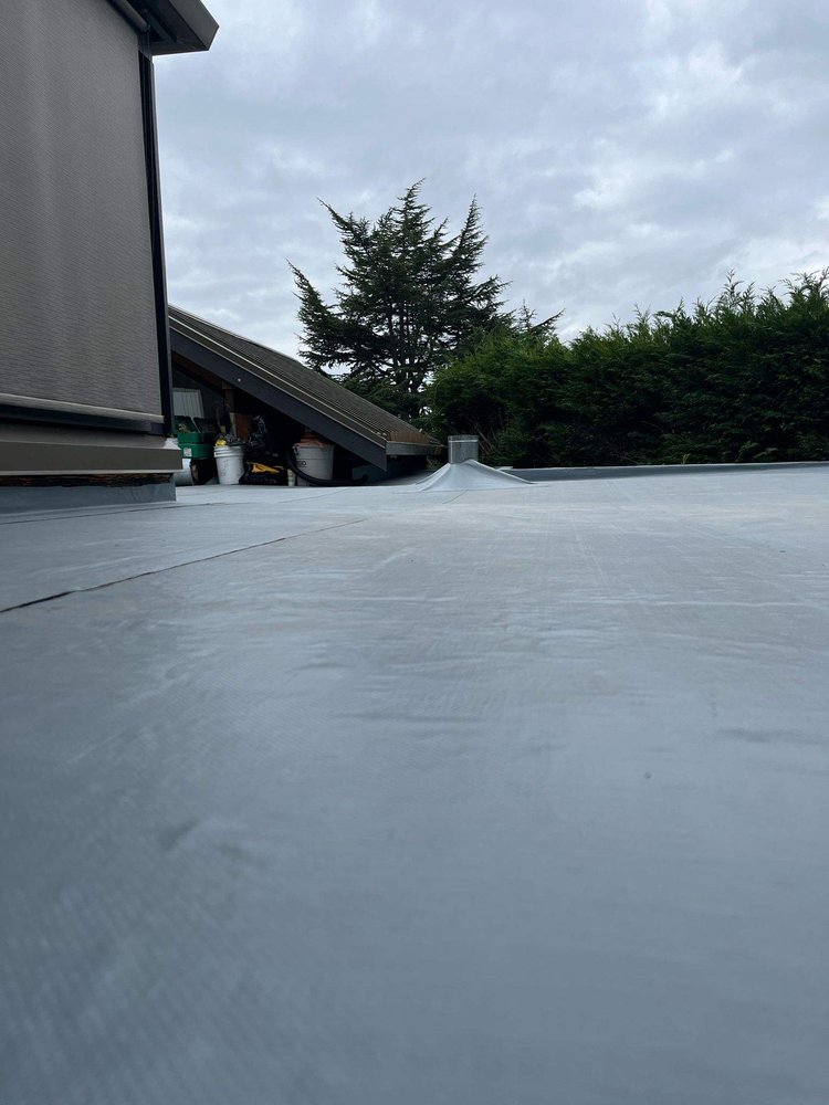 Reliable flat roof upgrade by Orca Roofing.

