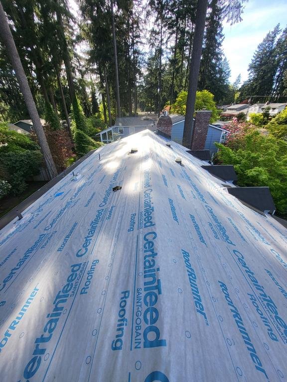 Clean and sturdy roof system with new gutters on Mercer Island.

