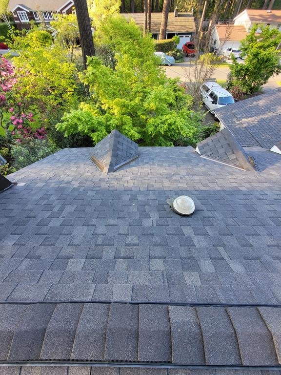Professional roof and gutter transformation in Mercer Island, Washington.