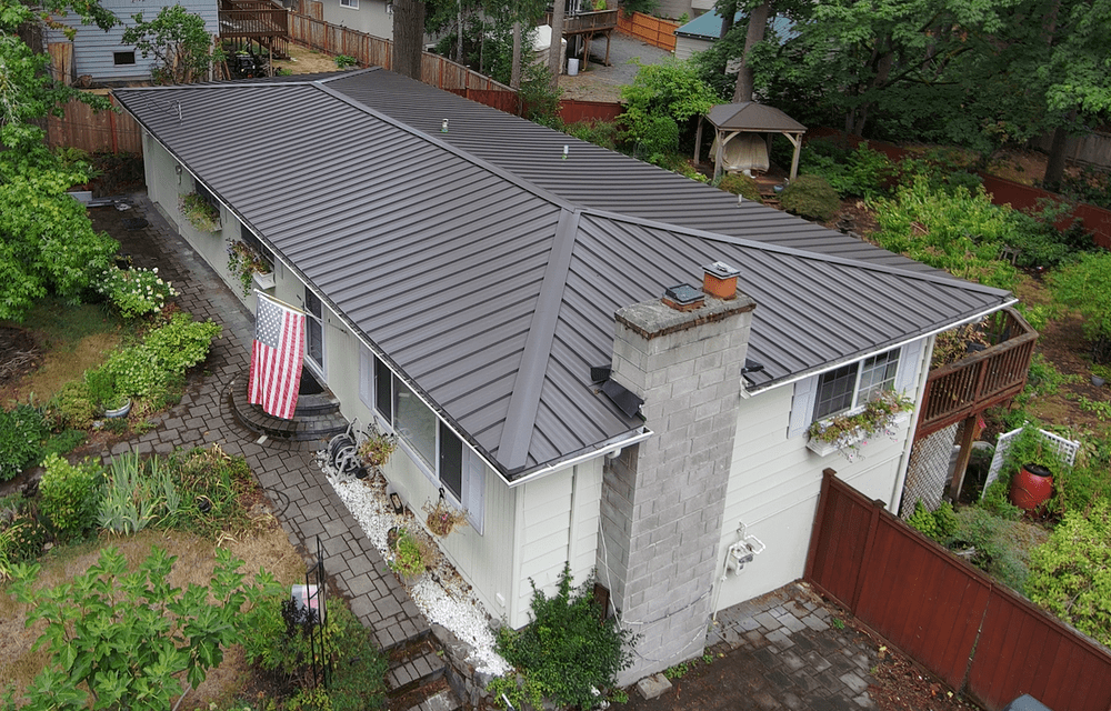 Metal roof transformation in Bellevue by Orca Roofing & Exteriors.

