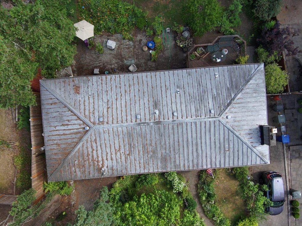 Bellevue home with a durable metal roof, replacing a leaking system.

