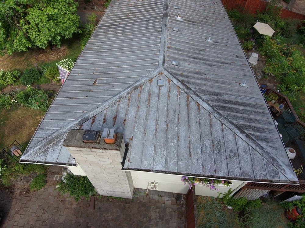 Bellevue property with a long-lasting metal roof by Orca Roofing.

