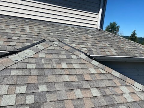 Roof cleaning service in Redmond, WA by Orca Roofing & Exteriors.

