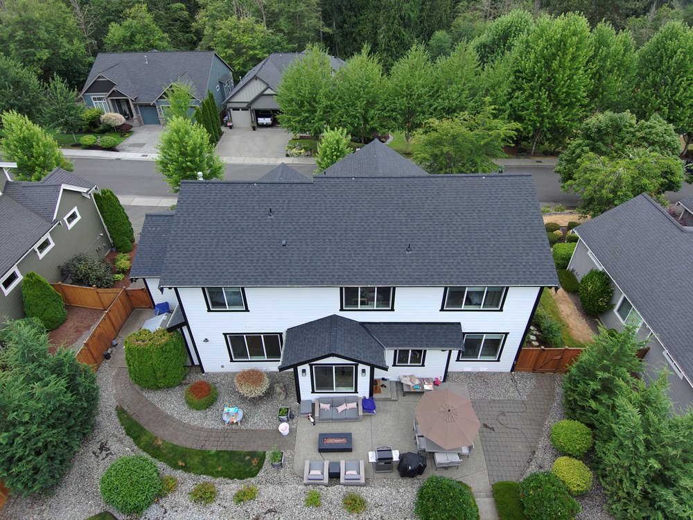 CertainTeed Landmark shingles in Moire Black on a Lake Tapps home by Orca Roofing.

