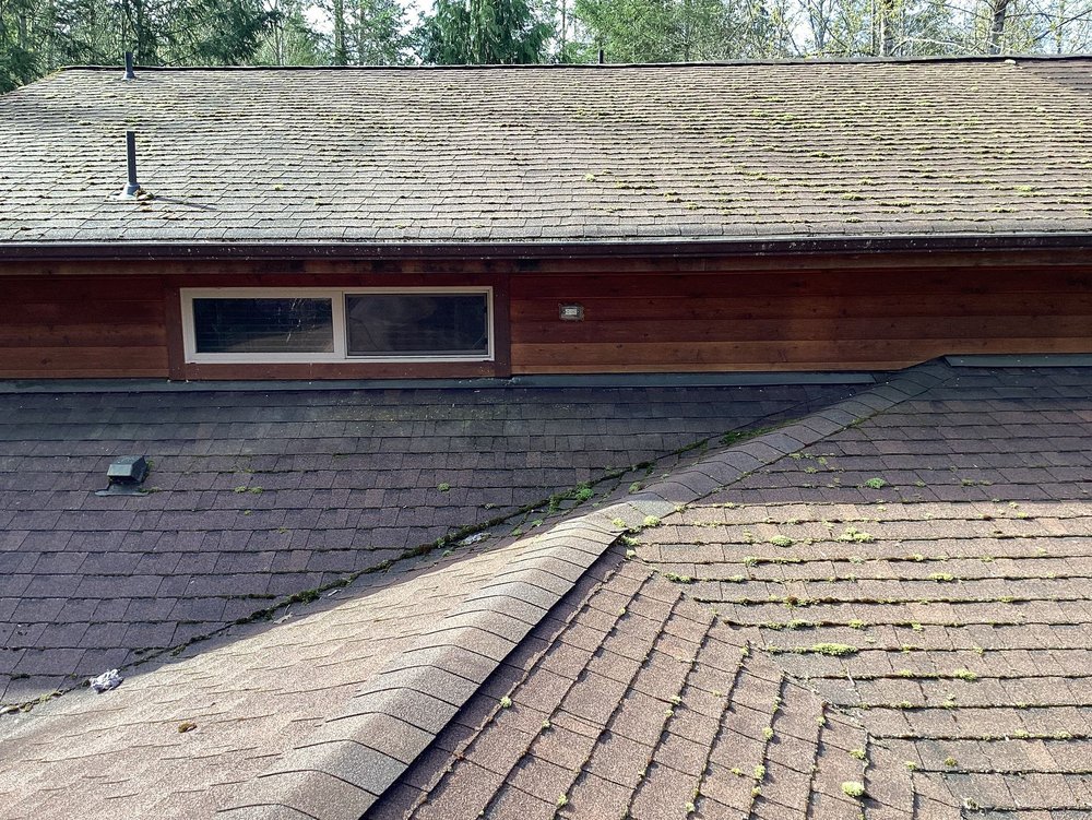 Moss and debris removed from a roof in Carnation, revealing its original beauty.