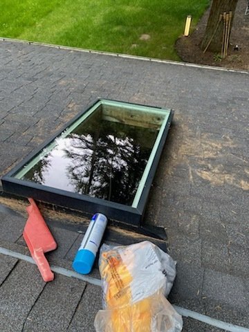 Before and after of a roof cleaning transforming a home in Woodinville, WA.

