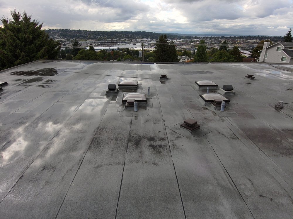 Professional commercial roof and siding project by Orca Roofing & Exteriors.
