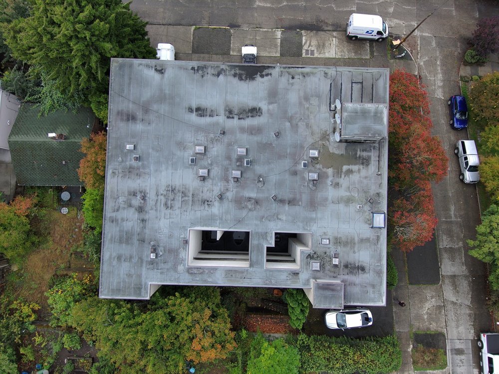 Full roof and siding replacement on a commercial building in Seattle.