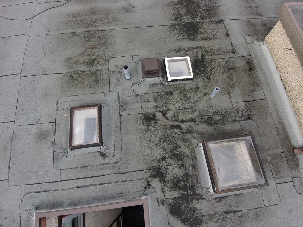 Seattle commercial building with new roof and siding.