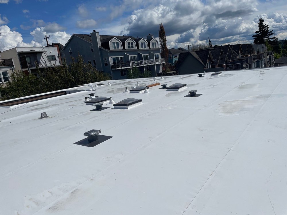 Completed commercial roofing and siding project in Seattle, Washington.
