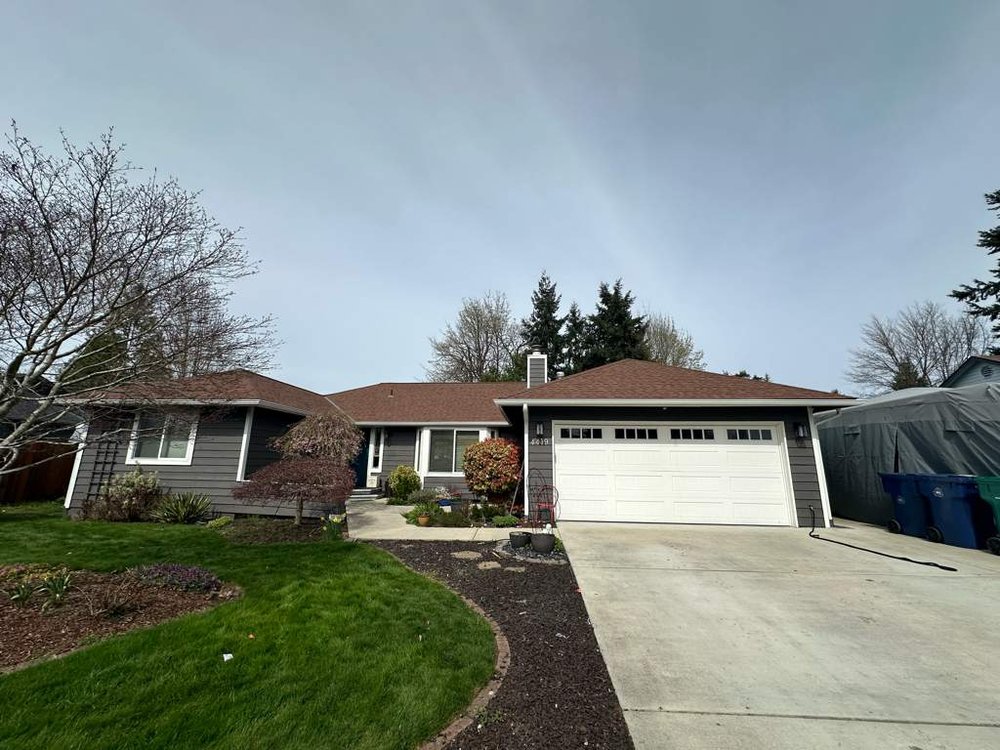 New gutter installation on a home in Everett by Orca Roofing & Exteriors.