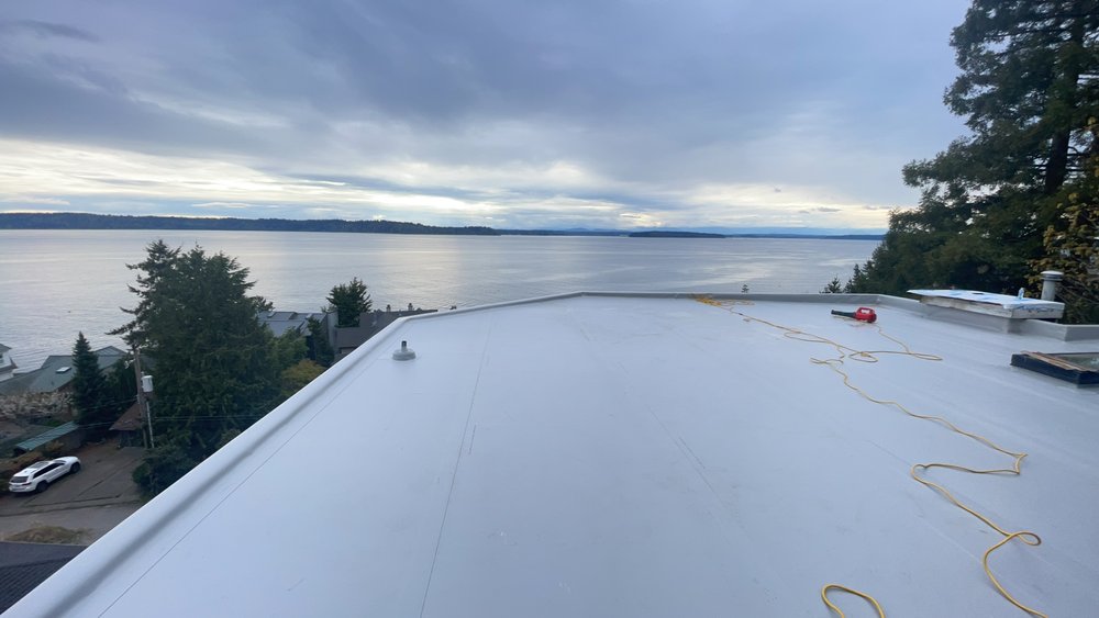 Completed roof project in Seattle by Orca Roofing, combining functionality and style.

