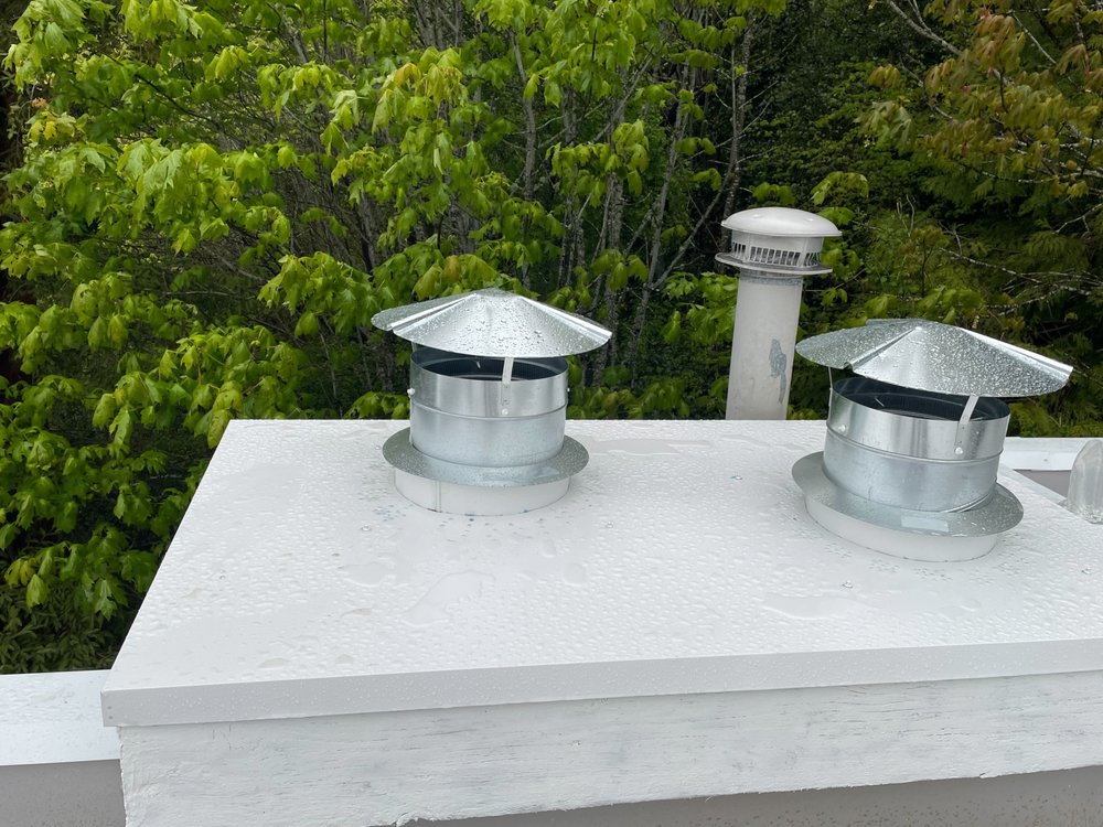 Seattle home with a newly installed PVC flat roof and shingle section.


