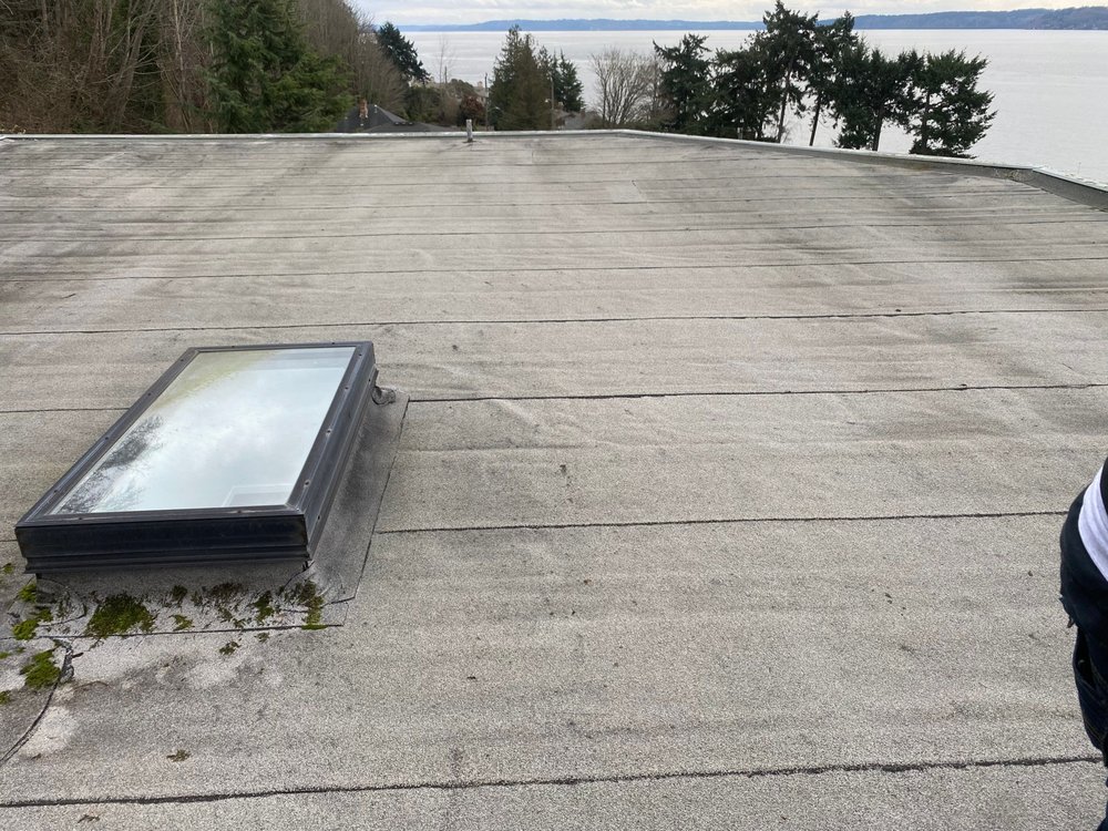 Flat roof makeover in Seattle: Torch Down to PVC conversion by Orca Roofing.

