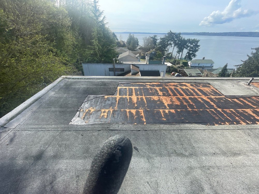 Low slope roof replacement project in Seattle by Orca Roofing & Exteriors.

