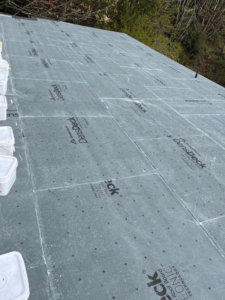 Flat roof transformation in Seattle by Orca Roofing.