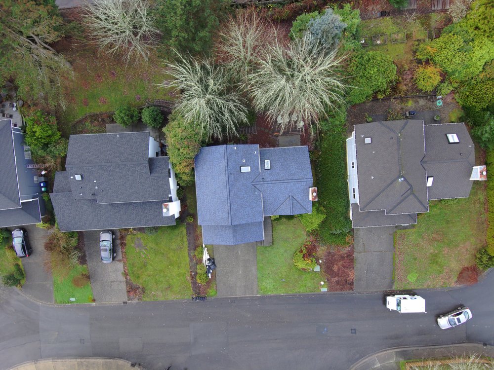Kirkland residence featuring Owens Corning Duration Harbor Blue shingles by Orca Roofing & Exteriors.