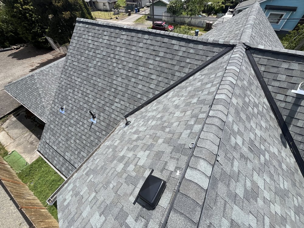 Residential shingle roof replacement in Tacoma, WA, enhancing home protection by Orca Roofing & Exteriors.