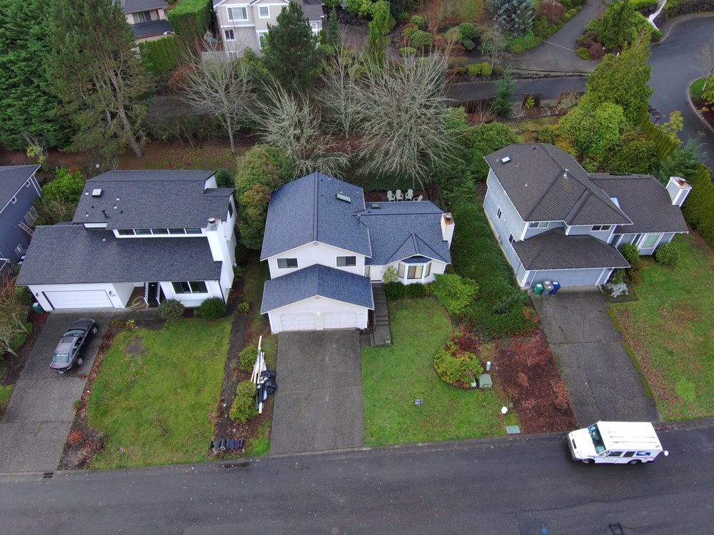 Elegant asphalt shingle roof in Harbor Blue, enhancing a Kirkland residential property.