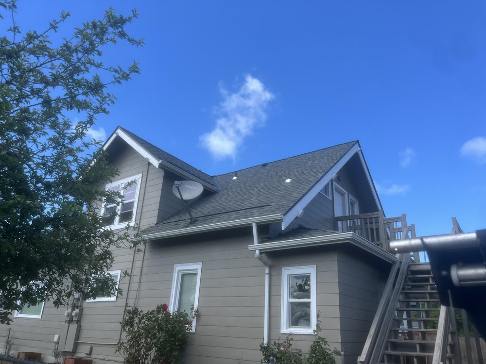 Complete roof transformation in Tacoma, from old shingles to new, sturdy structure.